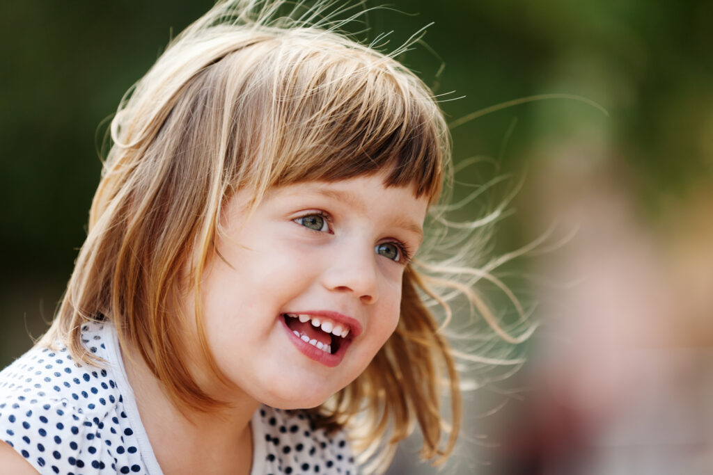 outdoor portrait of three year girl